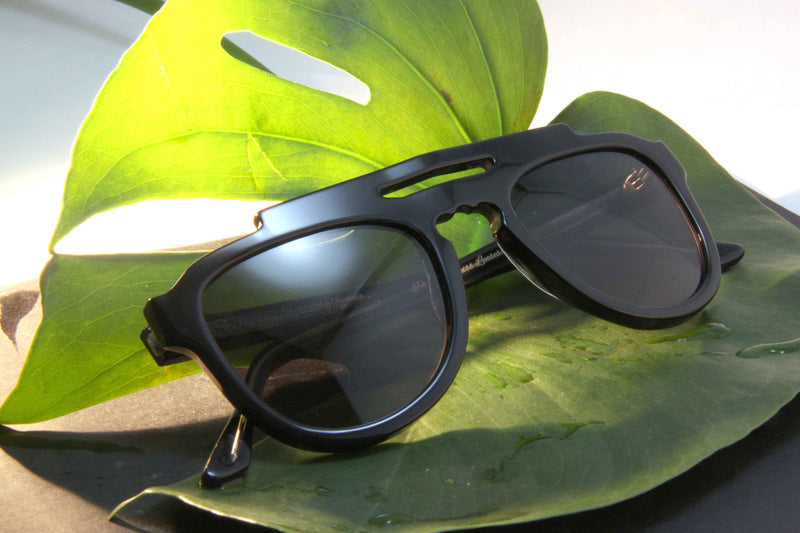 Black Steluda Polarised Sunglasses Made In Australia On Green Leaf